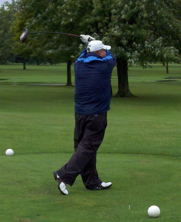 Joe King dressed for the weather tees off during the second round.&nbsp; You can see the difference a day makes if you look at Joe's pic above.&nbsp; (hint:&nbsp; shorts and a shirt with sunny skies)